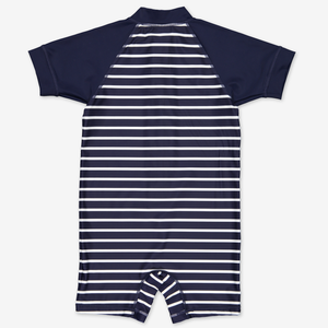 UPF 50 navy blue striped short sleeve kids swimsuit with a front zipper that has a chin guard that is gentle against the chin and cheeks.