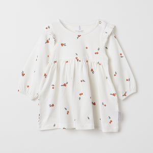 White Organic Cotton Floral Baby Dress from the Polarn O. Pyret baby collection. Ethically produced baby clothing.