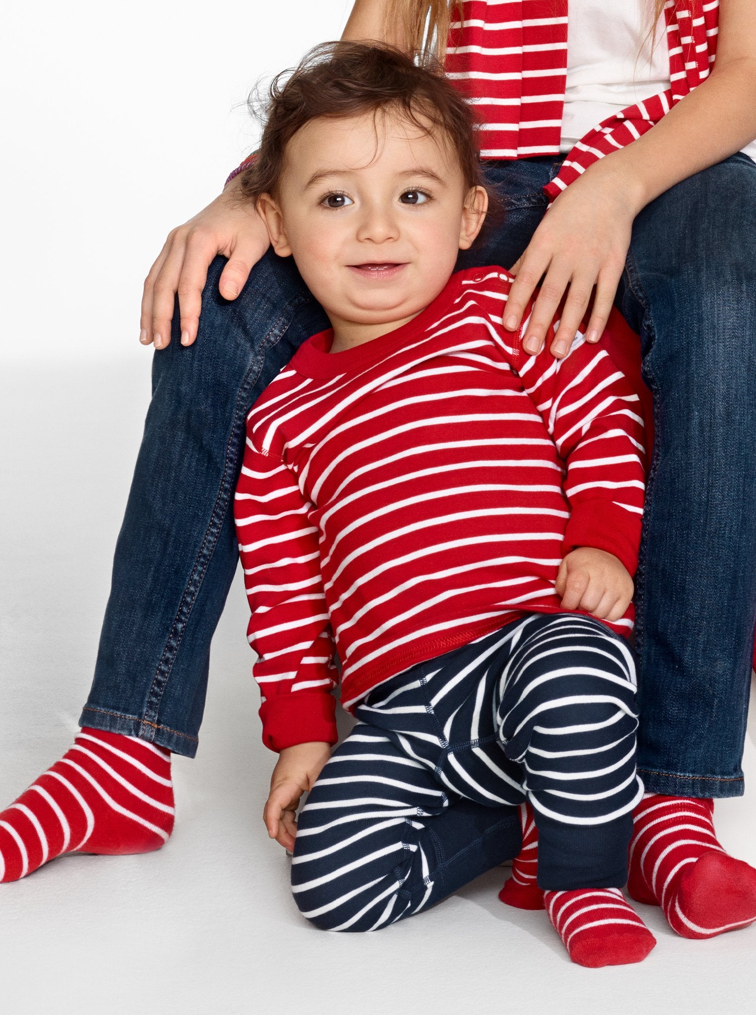 toddler wearing PO.P classic top and leggings in stripe design 