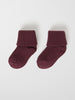 Organic Cotton Burgundy Baby Socks from the Polarn O. Pyret baby collection. Made using 100% GOTS Organic Cotton