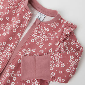 Organic Cotton Floral Pink Baby Romper from the Polarn O. Pyret baby collection. Nordic baby clothes made from sustainable sources.