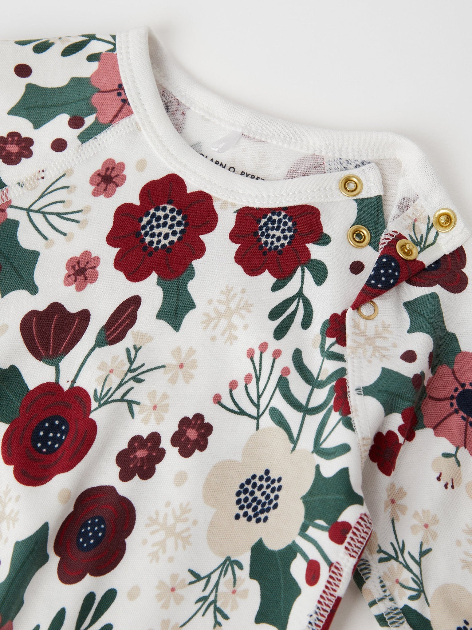 Xmas Floral Organic Cotton Babygrow from the Polarn O. Pyret baby collection. Nordic baby clothes made from sustainable sources.