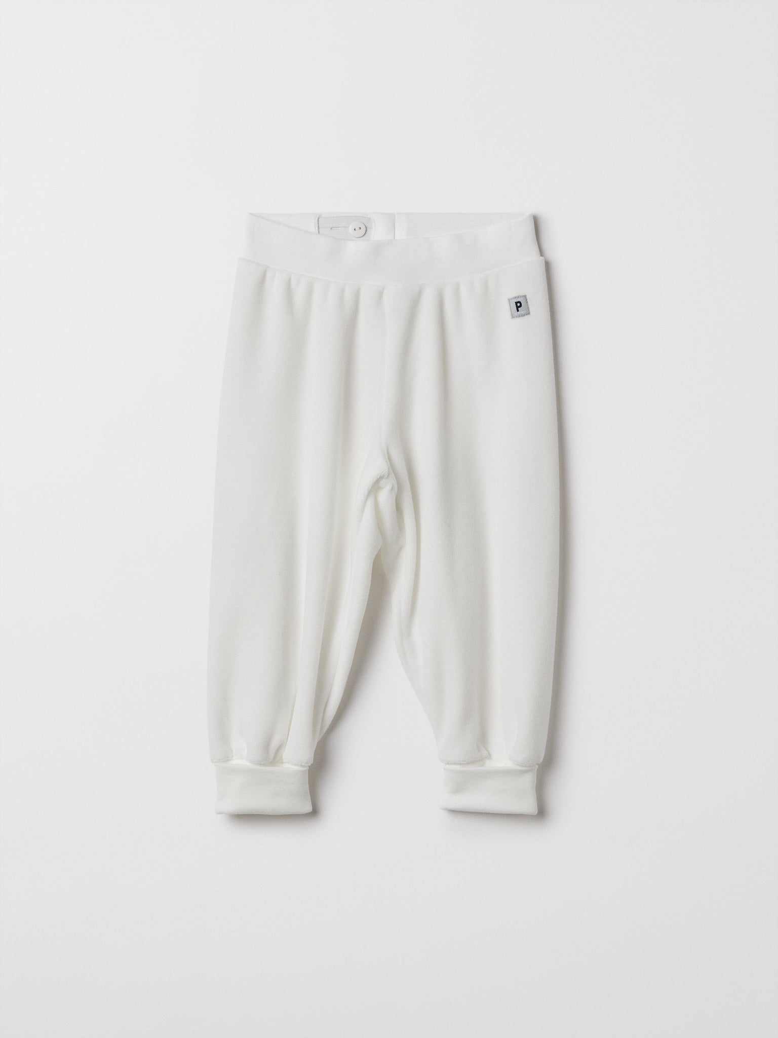 White Velour Baby Trousers from the Polarn O. Pyret baby collection. Nordic baby clothes made from sustainable sources.
