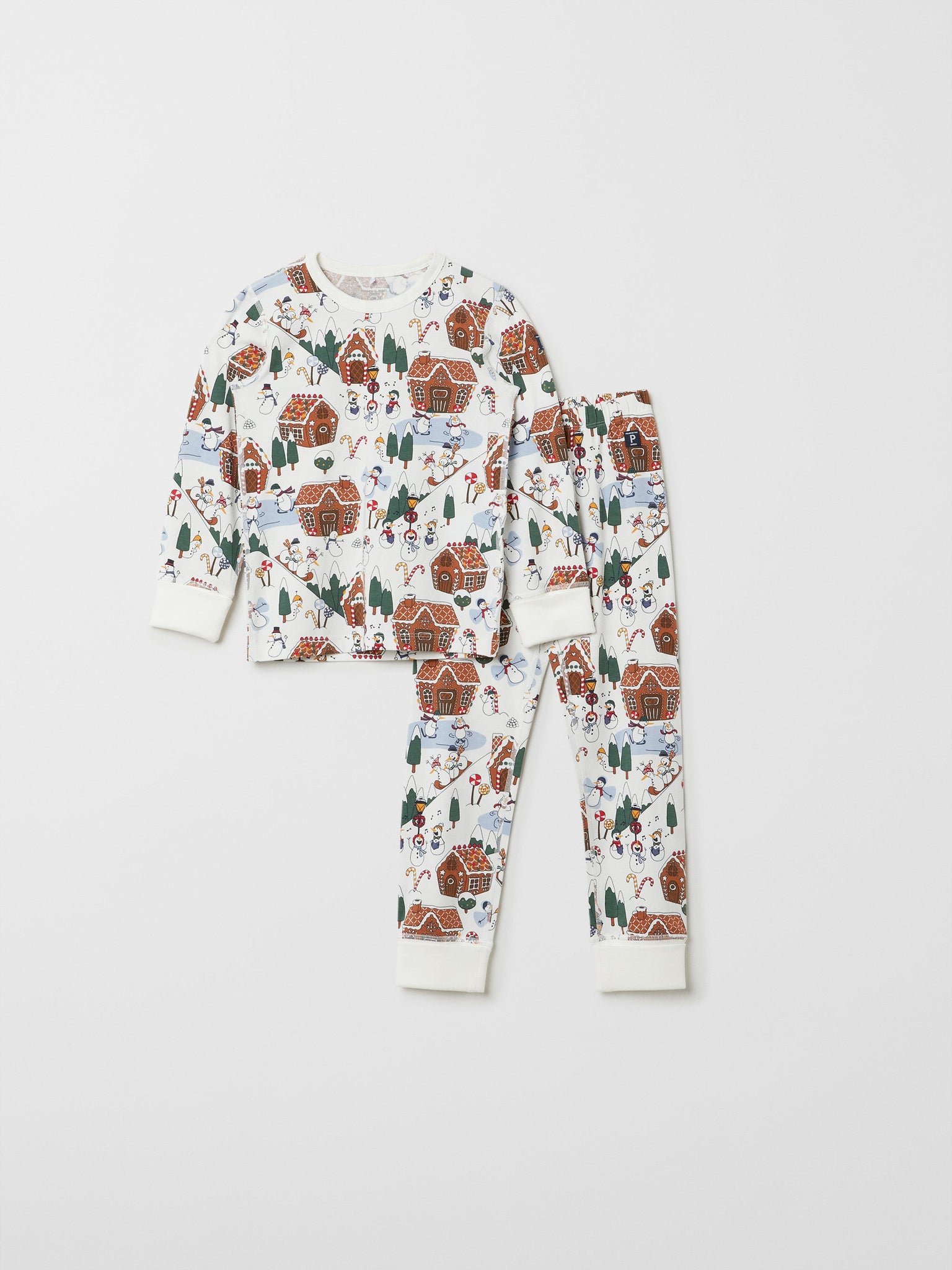 White Organic Kids Christmas Pyjamas from the Polarn O. Pyret kidswear collection. Ethically produced kids clothing.
