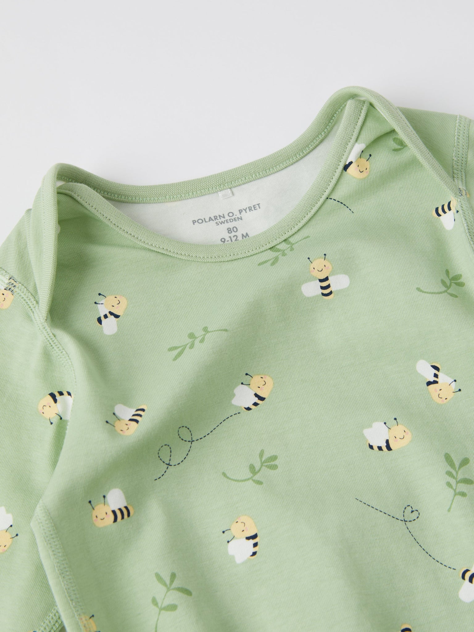 Bee Print Babygrow from the Polarn O. Pyret baby collection. Clothes made using sustainably sourced materials.