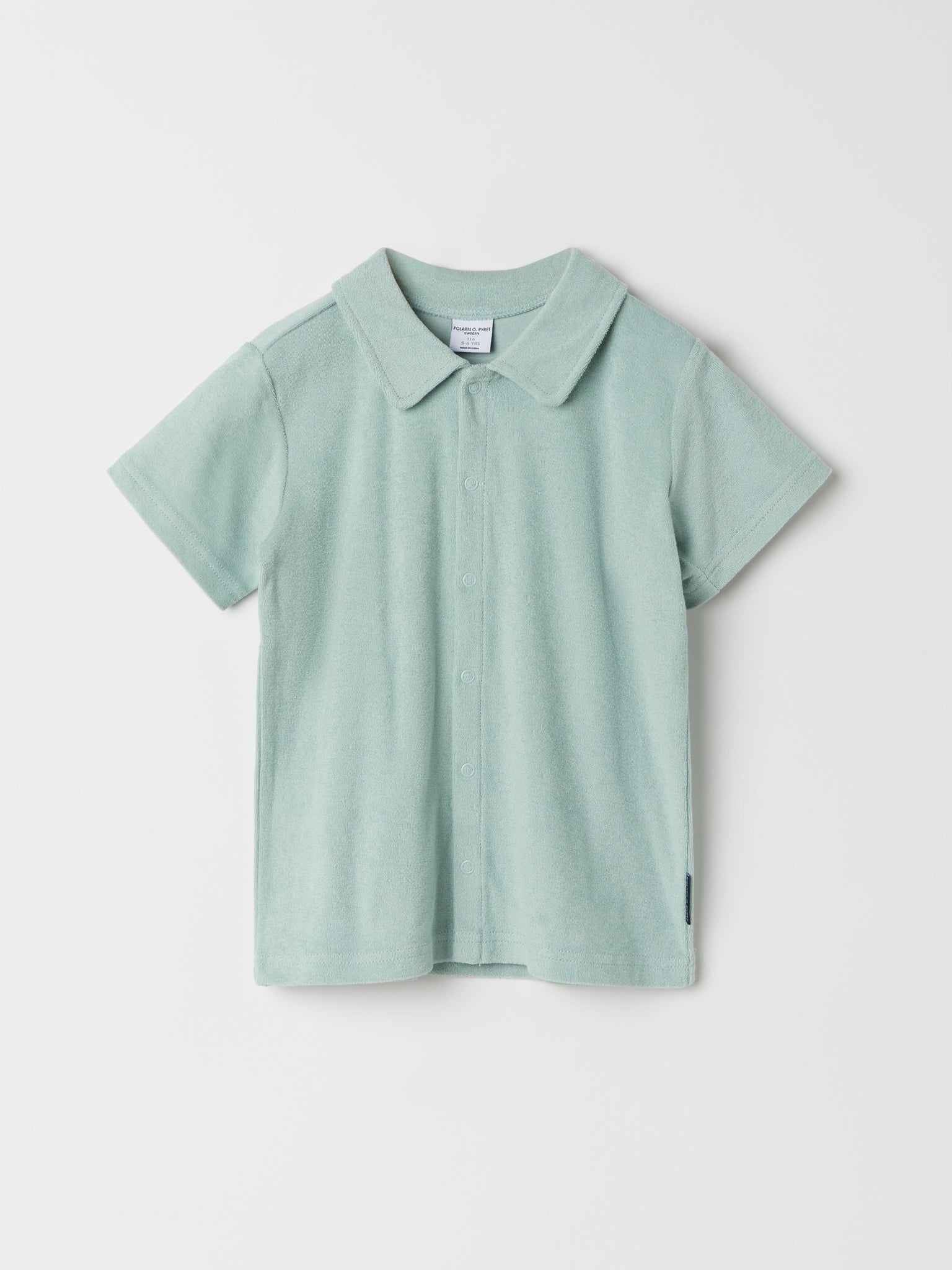Green Cotton Kids Polo Shirt from the Polarn O. Pyret kidswear collection. Ethically produced kids clothing.