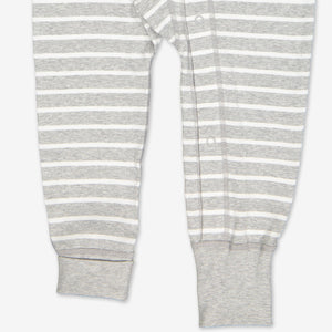 grey and white stripes baby all in one, ethical organic cotton, polarn o. pyret quality, showing poppers at the ankle.