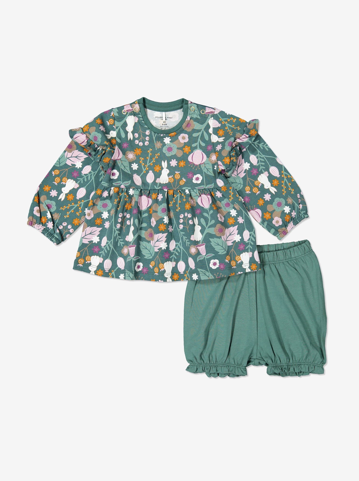 Matching set for baby girl in organic cotton comprising long sleeve top with woodland floral and bunny print. Shown with matching frilled bloomers in green.
