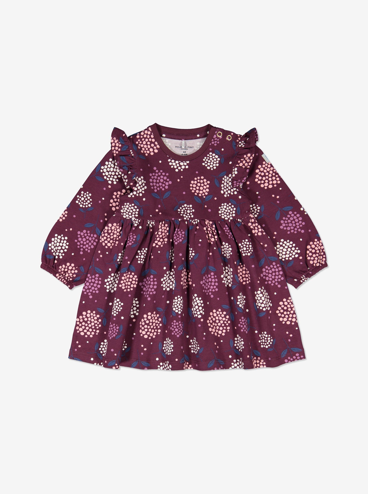 A purple floral long sleeve baby dress, designed with shoulder ruffles. Made of organic cotton.