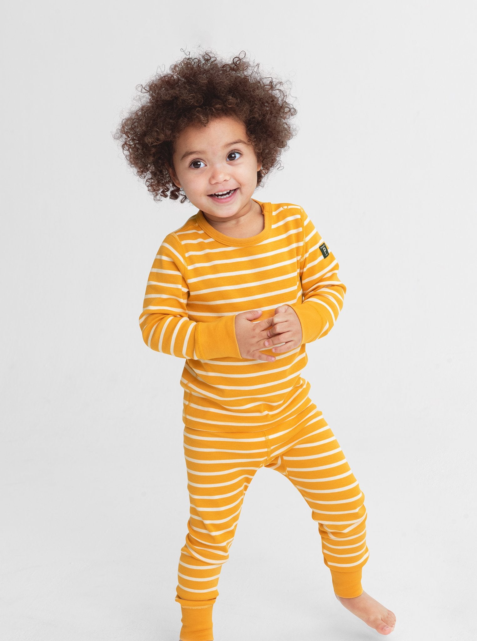 Organic Striped Yellow Kids Leggings from Polarn O. Pyret Kidswear. Made with 100% organic cotton.
