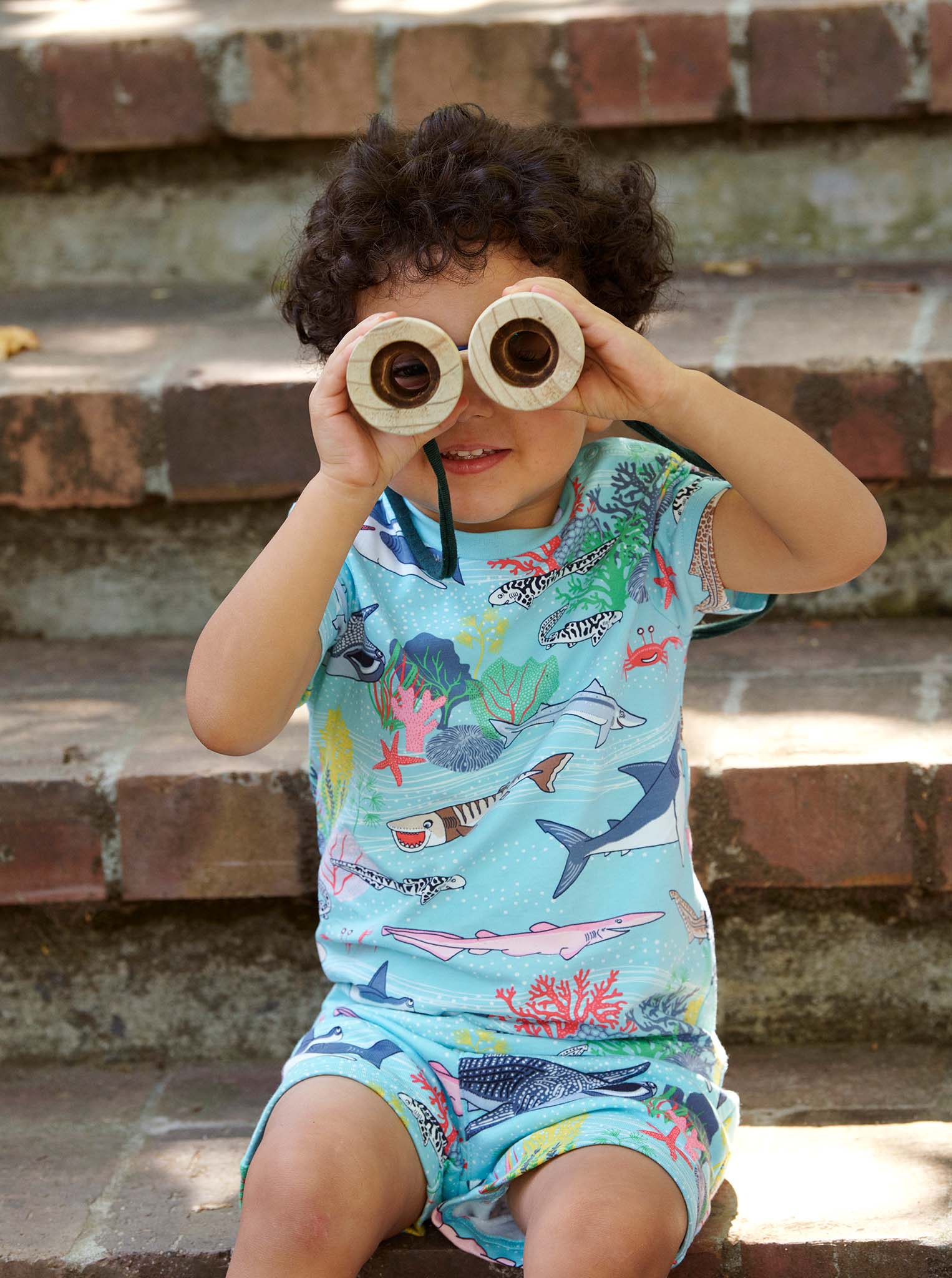 Sealife Print Blue Kids Shorts from Polarn O. Pyret Kidswear. Made from 100% GOTS Organic Cotton.