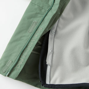 Green Kids Waterproof Shell Jacket from the Polarn O. Pyret kidswear collection. Ethically produced outerwear.