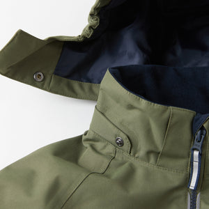 Green Waterproof Kids Jacket from the Polarn O. Pyret kidswear collection. Made from sustainable sources.