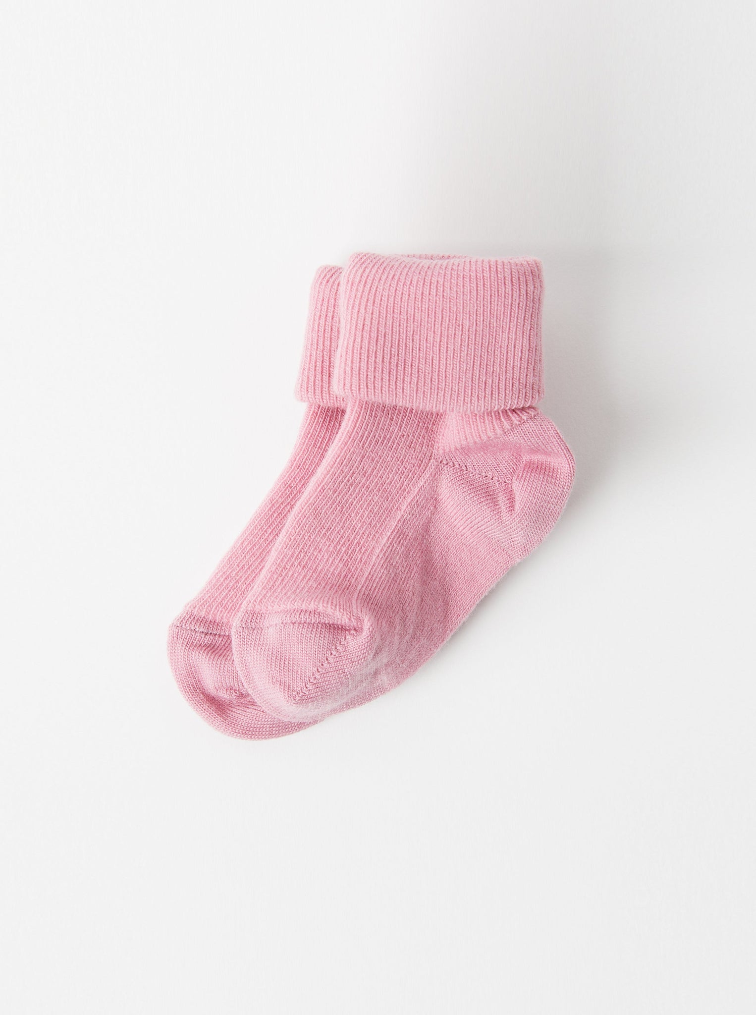 Pink Merino Wool Baby Socks from the Polarn O. Pyret kidswear collection. Made from sustainable sources.