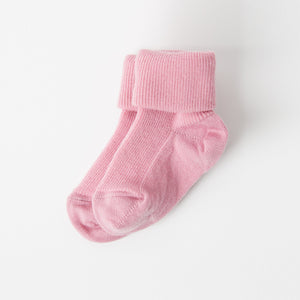Pink Merino Wool Baby Socks from the Polarn O. Pyret kidswear collection. Made from sustainable sources.