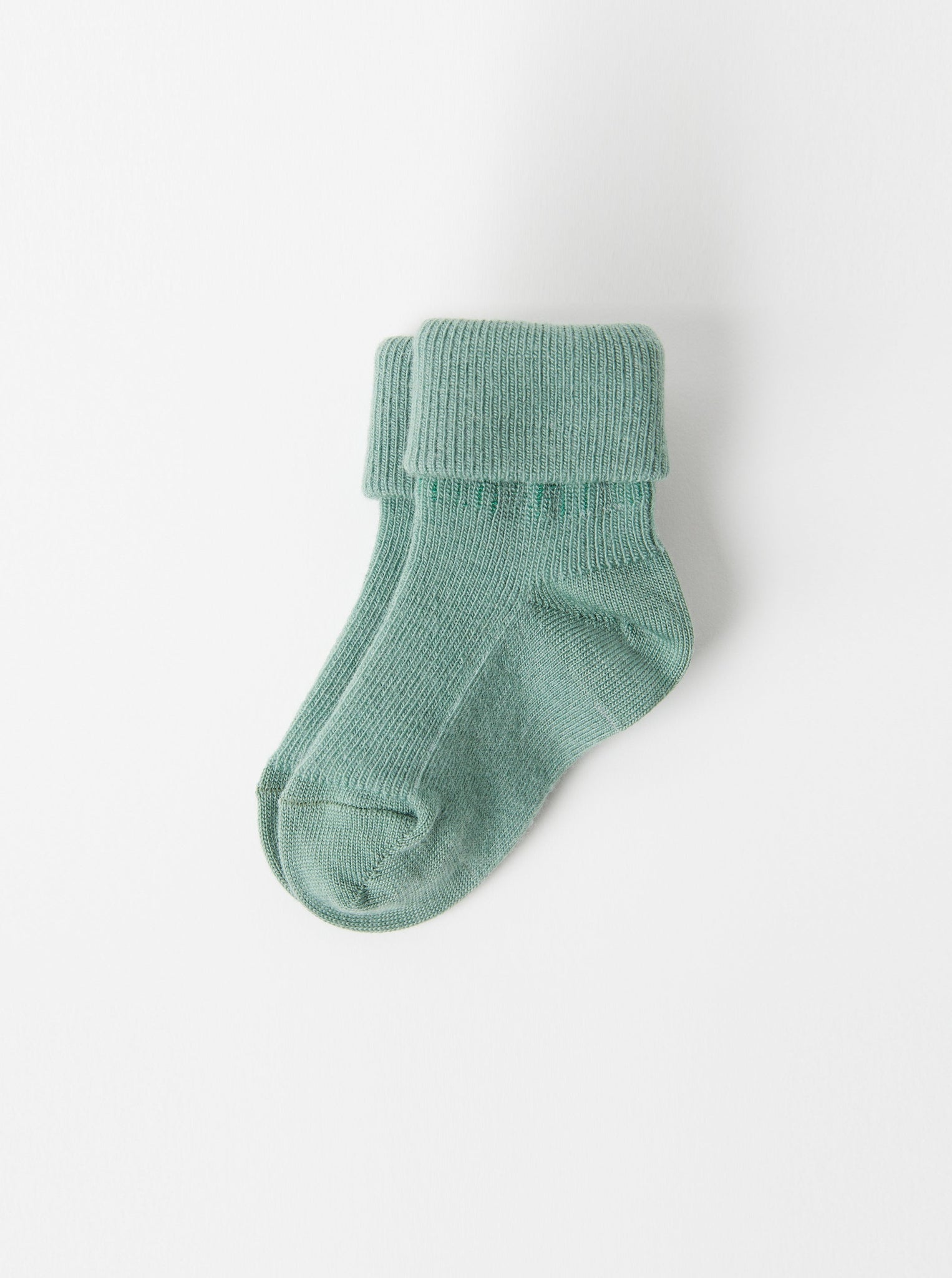 Green Merino Wool Baby Socks from the Polarn O. Pyret kidswear collection. Ethically produced kids outerwear.