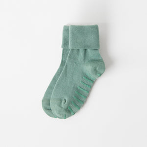 Green Merino Wool Baby Socks from the Polarn O. Pyret kidswear collection. The best ethical kids outerwear.