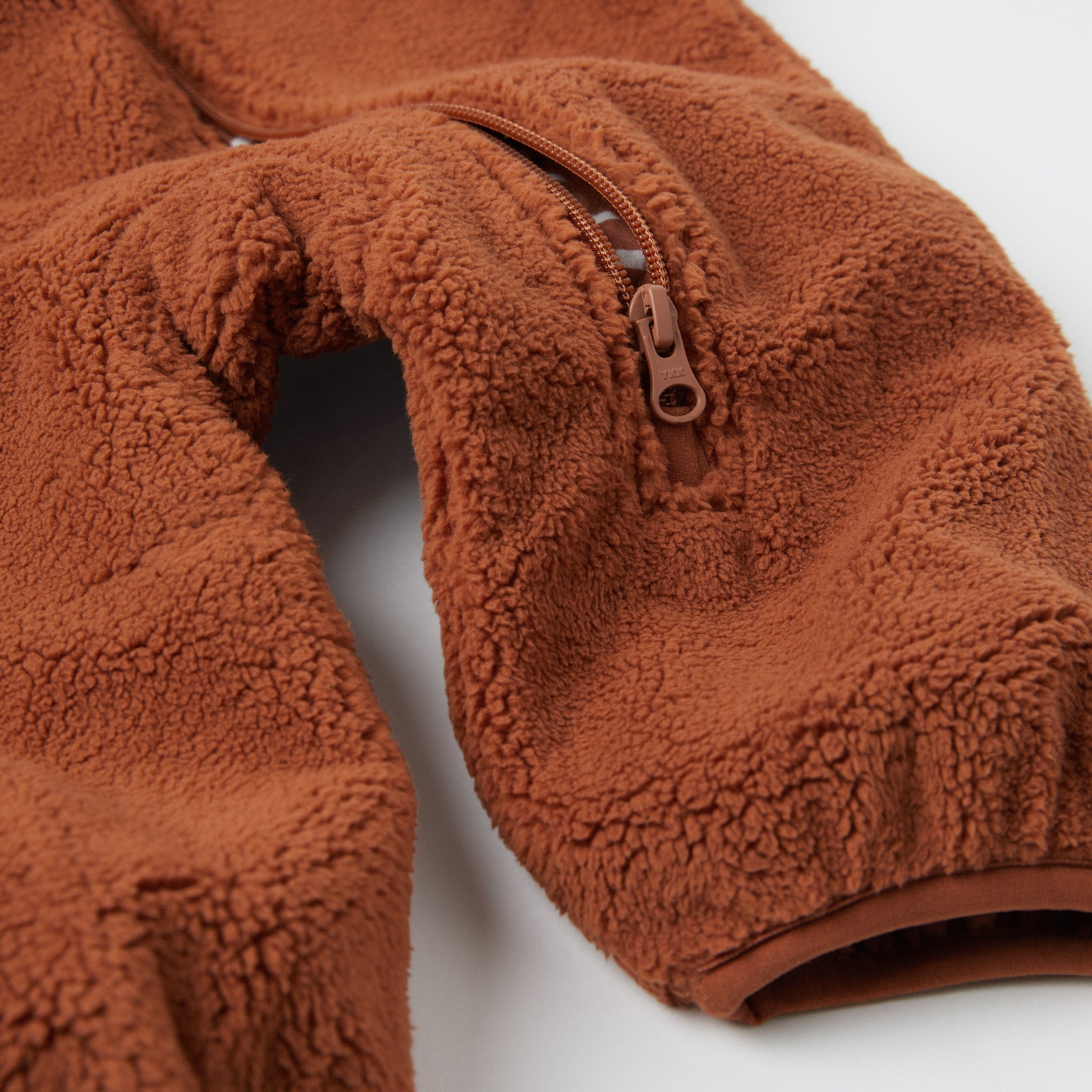 Fleece Teddy Bear Baby Pramsuit from the Polarn O. Pyret kidswear collection. Ethically produced outerwear.