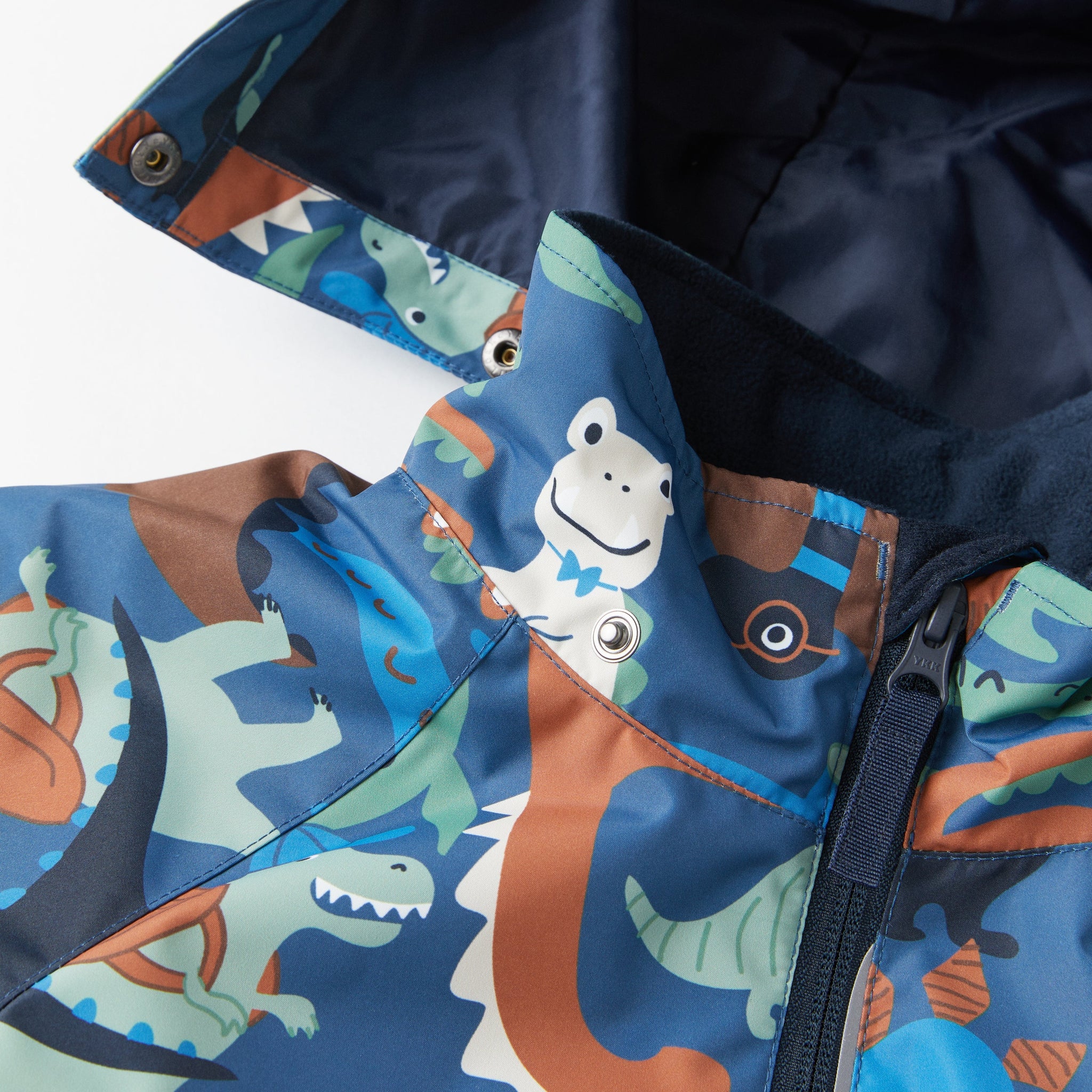Dinosaur Print Kids Waterproof Coat from the Polarn O. Pyret kidswear collection. Made from sustainable sources.