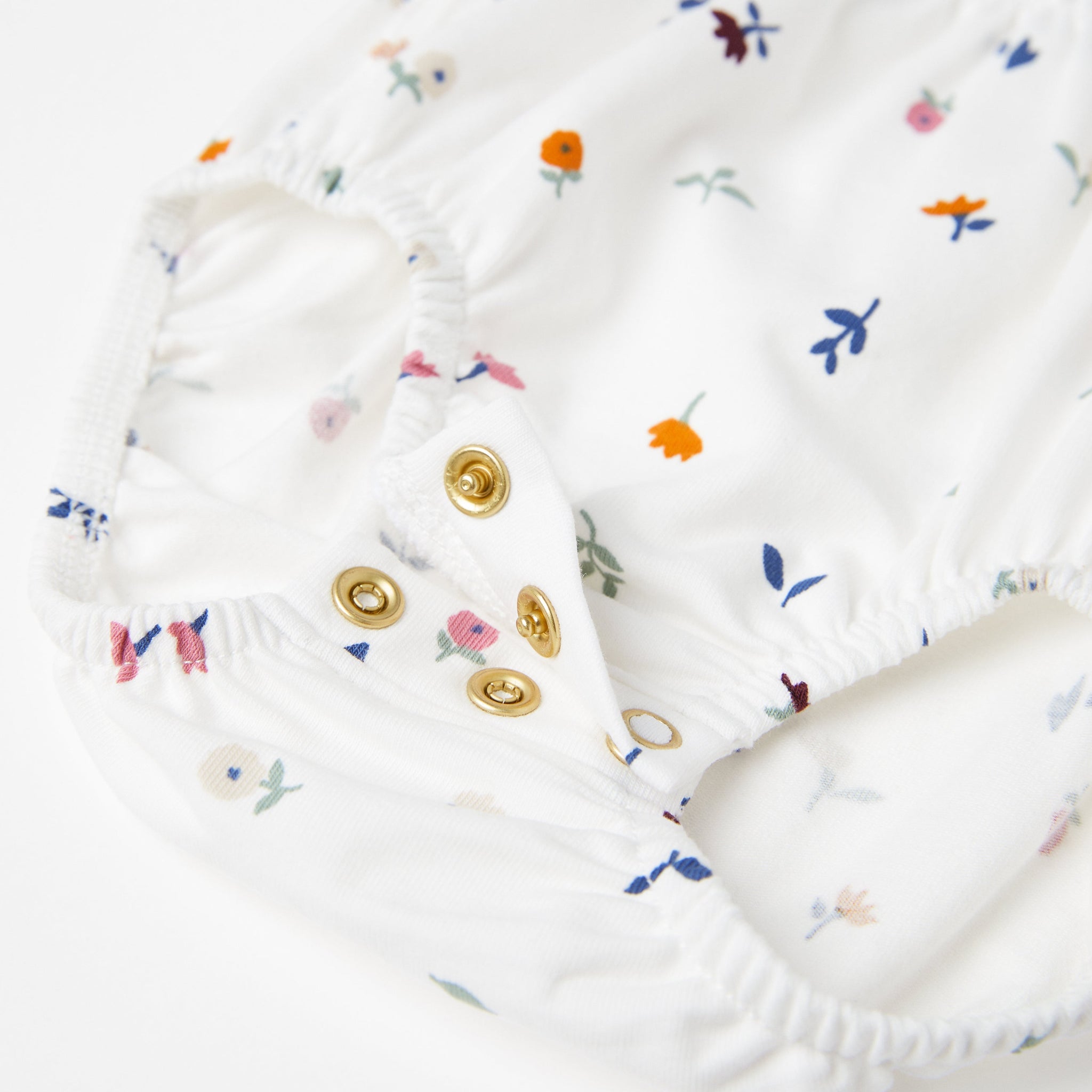 Floral White Newborn Babygrow from the Polarn O. Pyret Kidswear collection. The best ethical kids clothes
