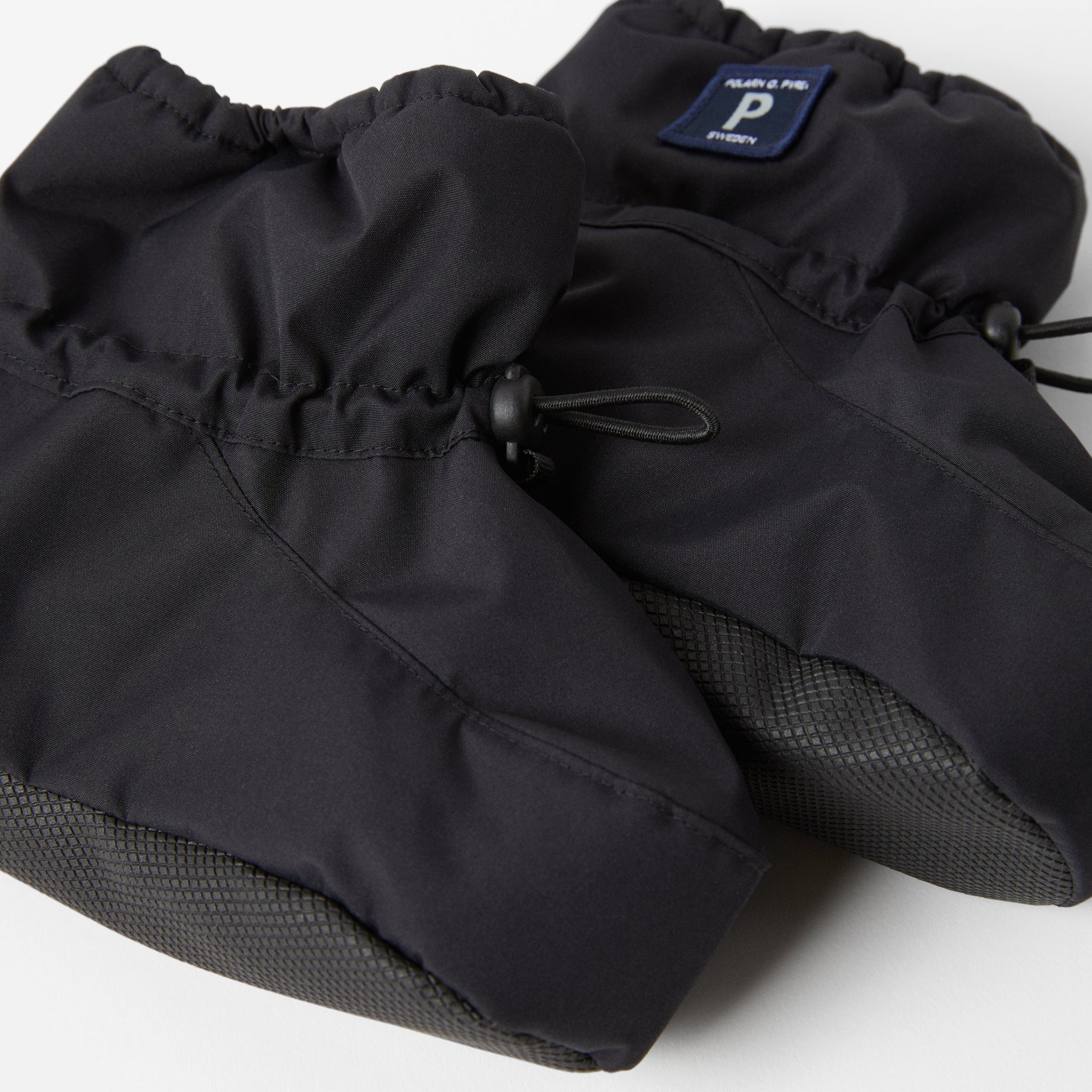 Black Padded Baby Booties from the Polarn O. Pyret kidswear collection. The best ethical kids outerwear.