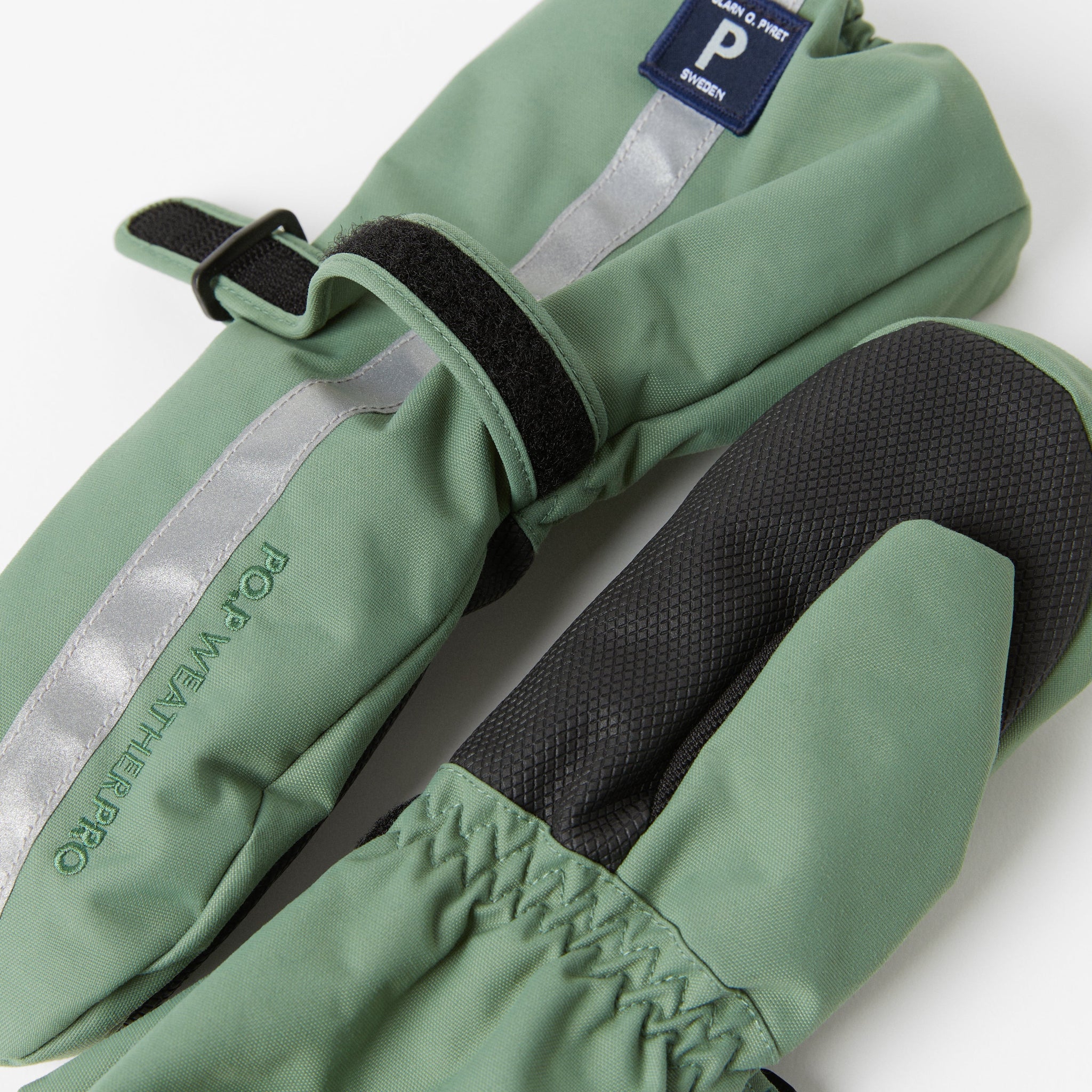 Green Padded Kids Waterproof Mittens from the Polarn O. Pyret kidswear collection. Ethically produced outerwear.