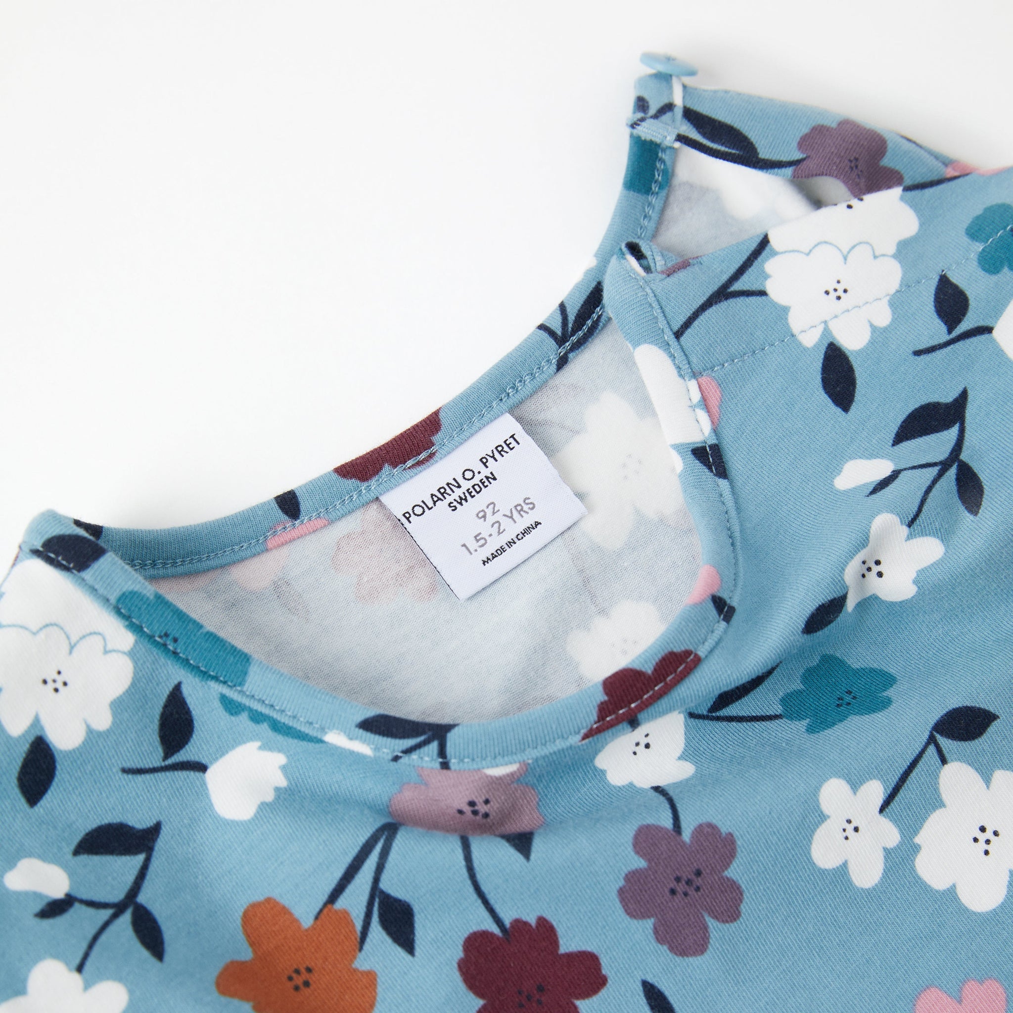 Cotton Blue Floral Girls Dress from the Polarn O. Pyret kidswear collection. Nordic kids clothes made from sustainable sources.