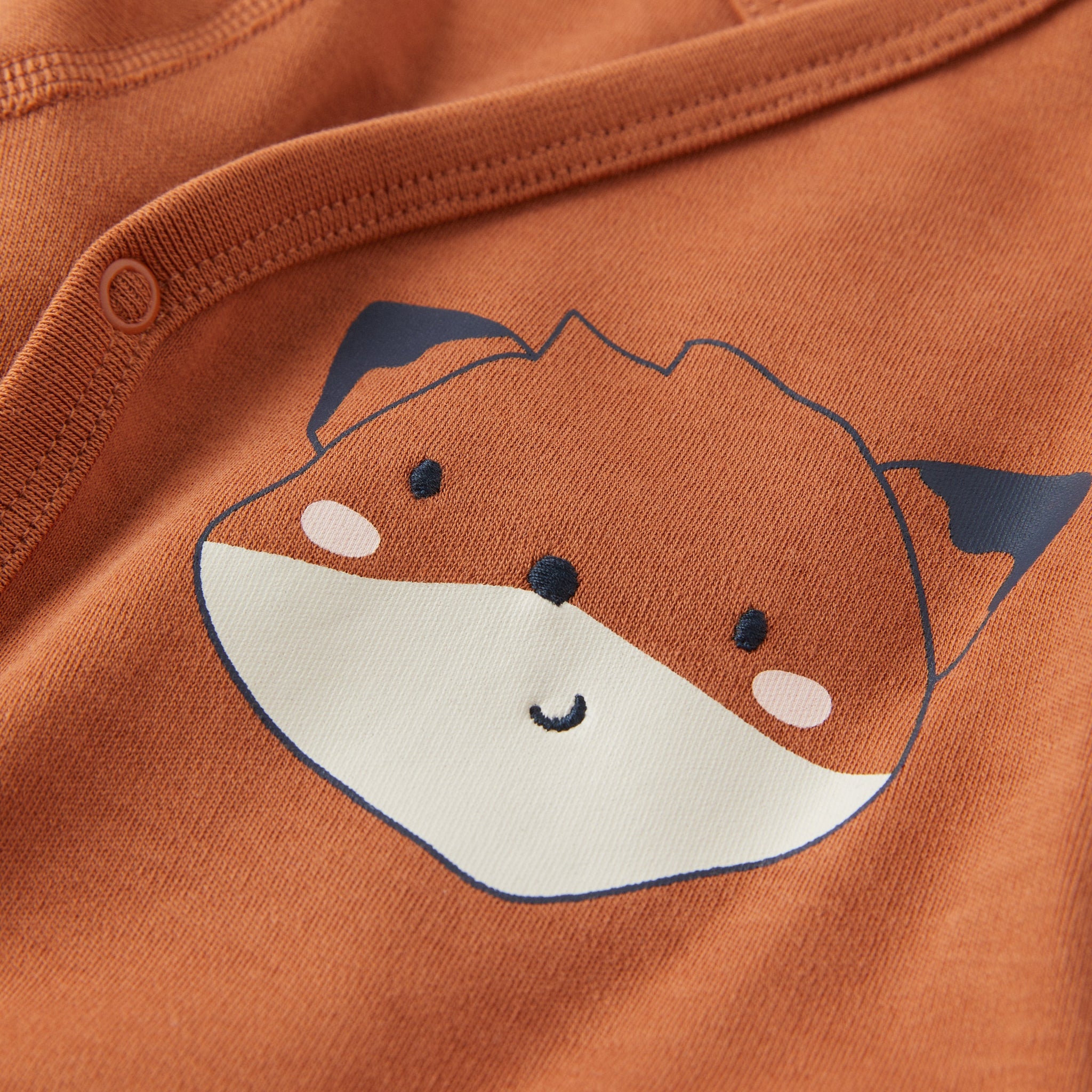 Cotton Orange Wraparound Babygrow from the Polarn O. Pyret babywear collection. Nordic baby clothes made from sustainable sources.
