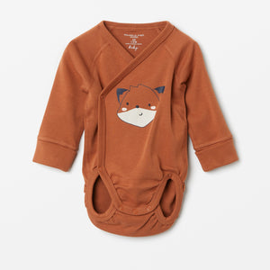Cotton Orange Wraparound Babygrow from the Polarn O. Pyret babywear collection. Nordic baby clothes made from sustainable sources.
