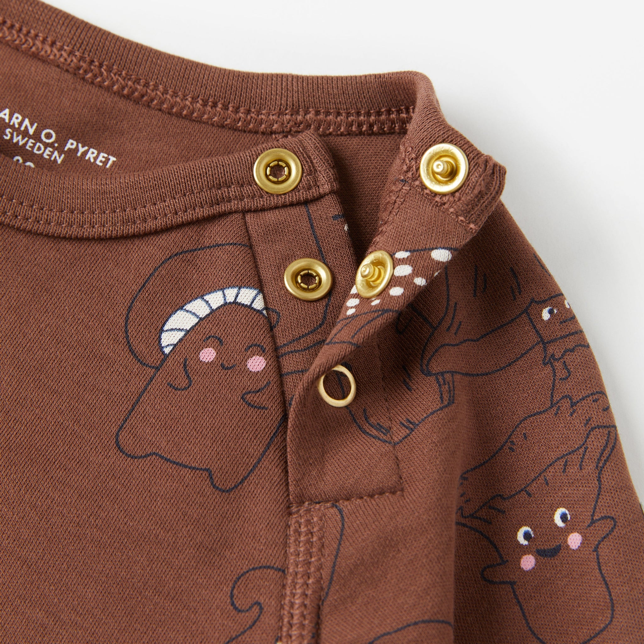 Brown Organic Cotton Babygrow from the Polarn O. Pyret babywear collection. Nordic baby clothes made from sustainable sources.