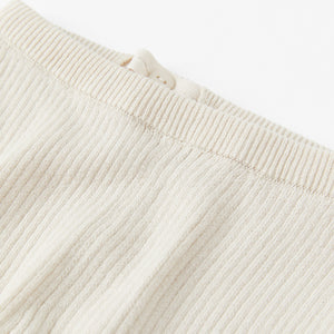 Ribbed White Knitted Baby Trousers from the Polarn O. Pyret babywear collection. Nordic baby clothes made from sustainable sources.