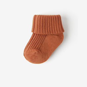 Soft Orange Baby Socks from the Polarn O. Pyret babywear collection. The best ethical baby clothes