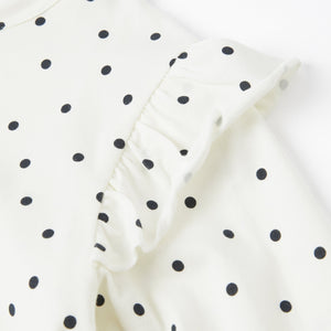 White Polka Dot Kids Top from the Polarn O. Pyret kidswear collection. Ethically produced kids clothing.