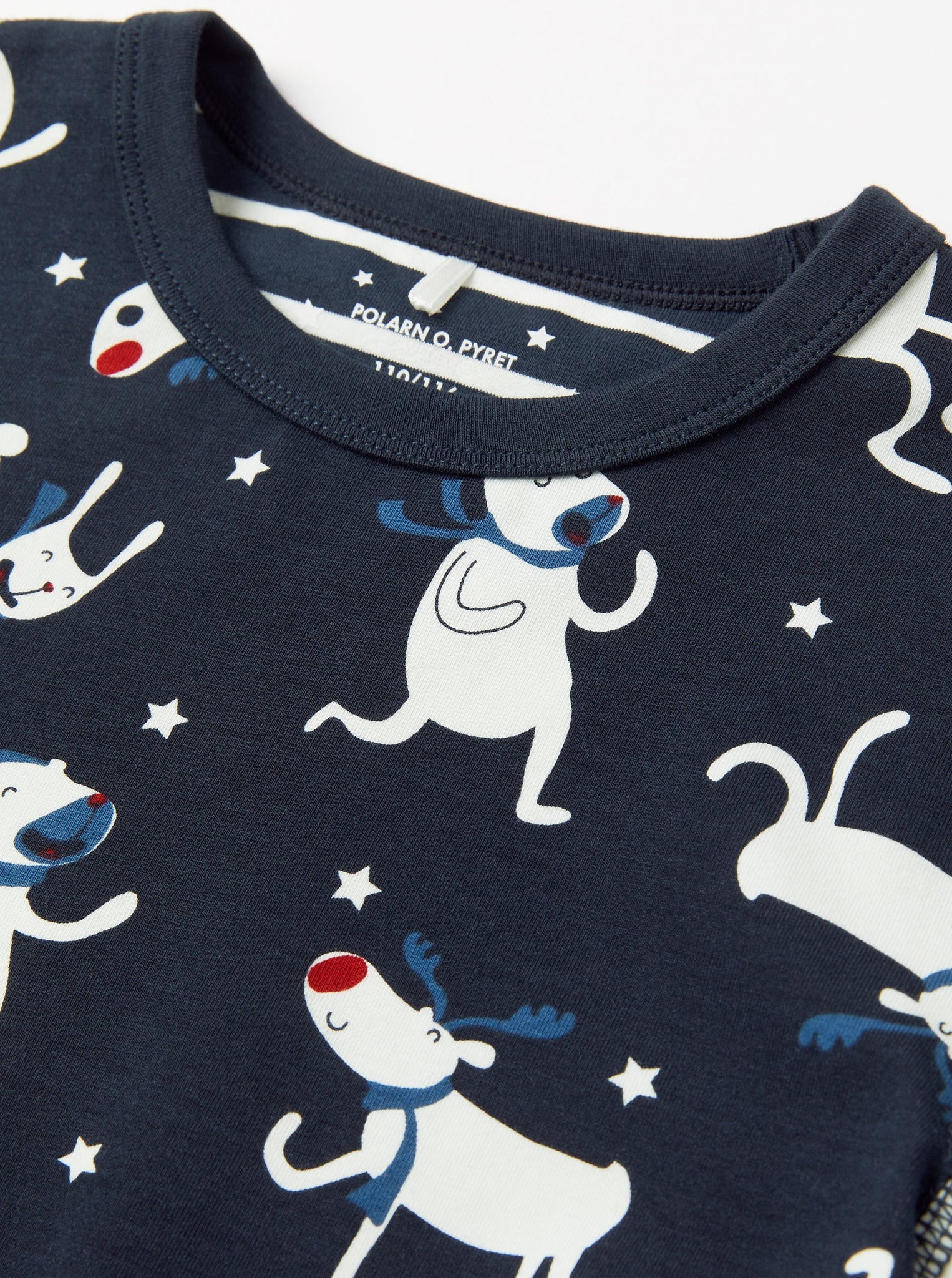 Organic Cotton Kids Christmas Pyjamas from the Polarn O. Pyret kidswear collection. Clothes made using sustainably sourced materials.