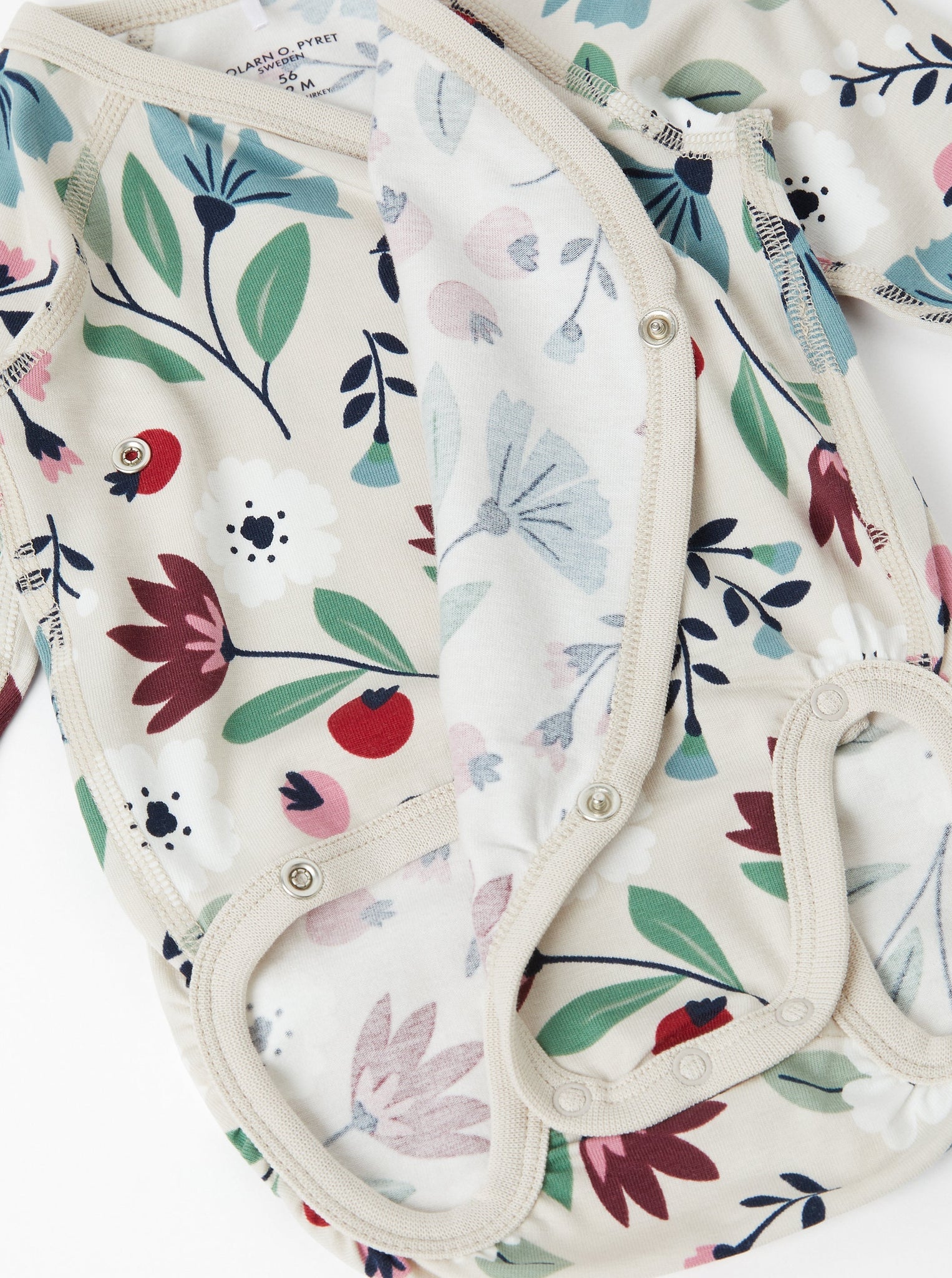 Floral Print Wraparound Babygrow from the Polarn O. Pyret baby collection. Nordic baby clothes made from sustainable sources.
