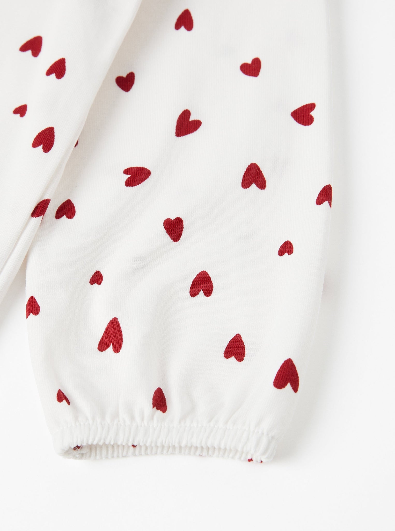 Heart Print White Babygrow from the Polarn O. Pyret baby collection. Clothes made using sustainably sourced materials.