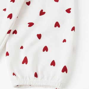 Heart Print White Babygrow from the Polarn O. Pyret baby collection. Clothes made using sustainably sourced materials.