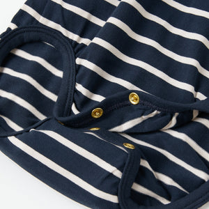 Newborn Polo Shirt Babygrow from the Polarn O. Pyret baby collection. Nordic baby clothes made from sustainable sources.