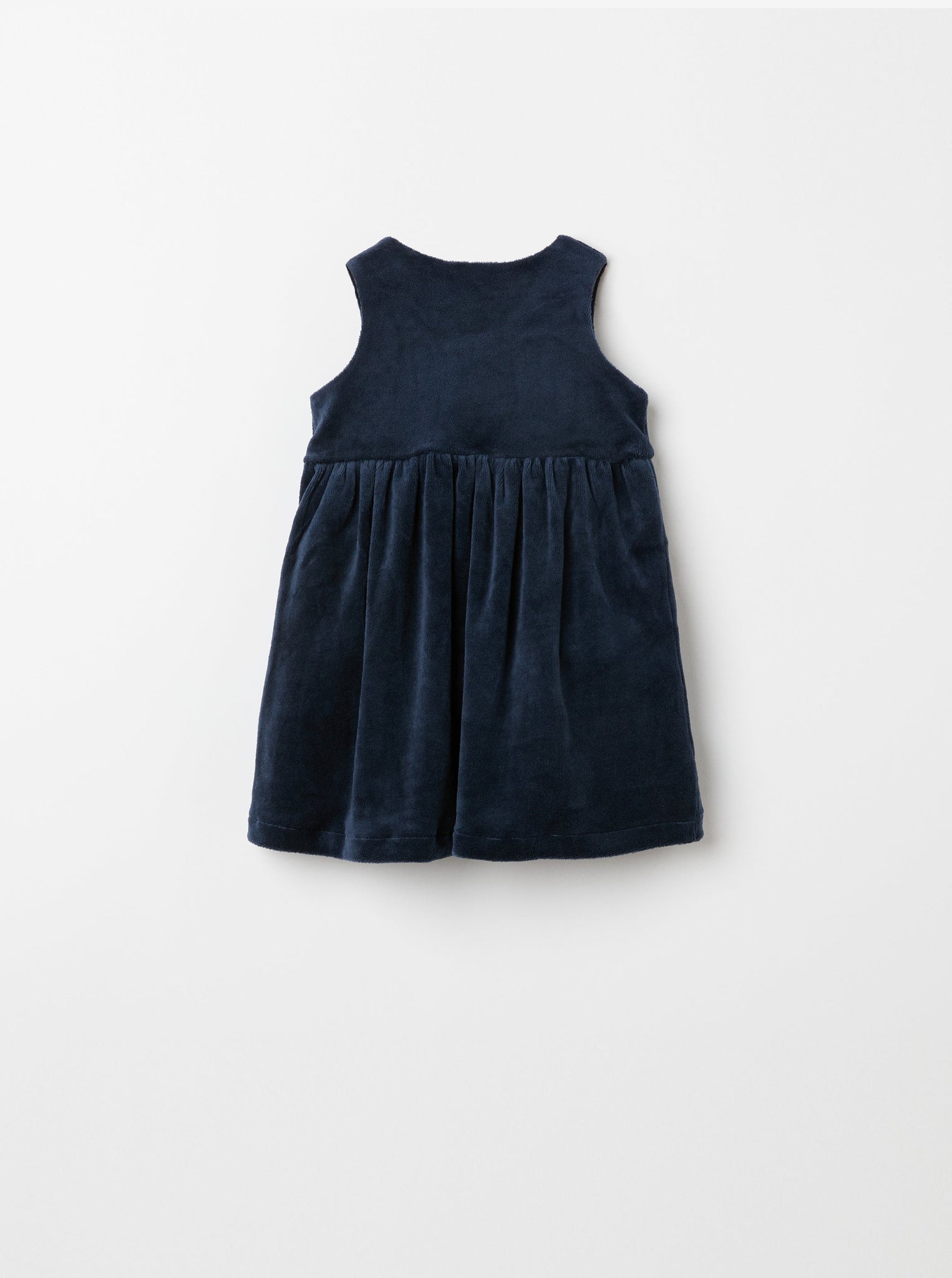 Navy Velour Baby Pinafore Dress from the Polarn O. Pyret baby collection. Nordic baby clothes made from sustainable sources.