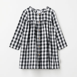 Organic Cotton Checked Baby Dress from the Polarn O. Pyret baby collection. Ethically produced baby clothing.