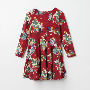 Red Girls Festive Twirl Dress from the Polarn O. Pyret kidswear collection. Nordic kids clothes made from sustainable sources.