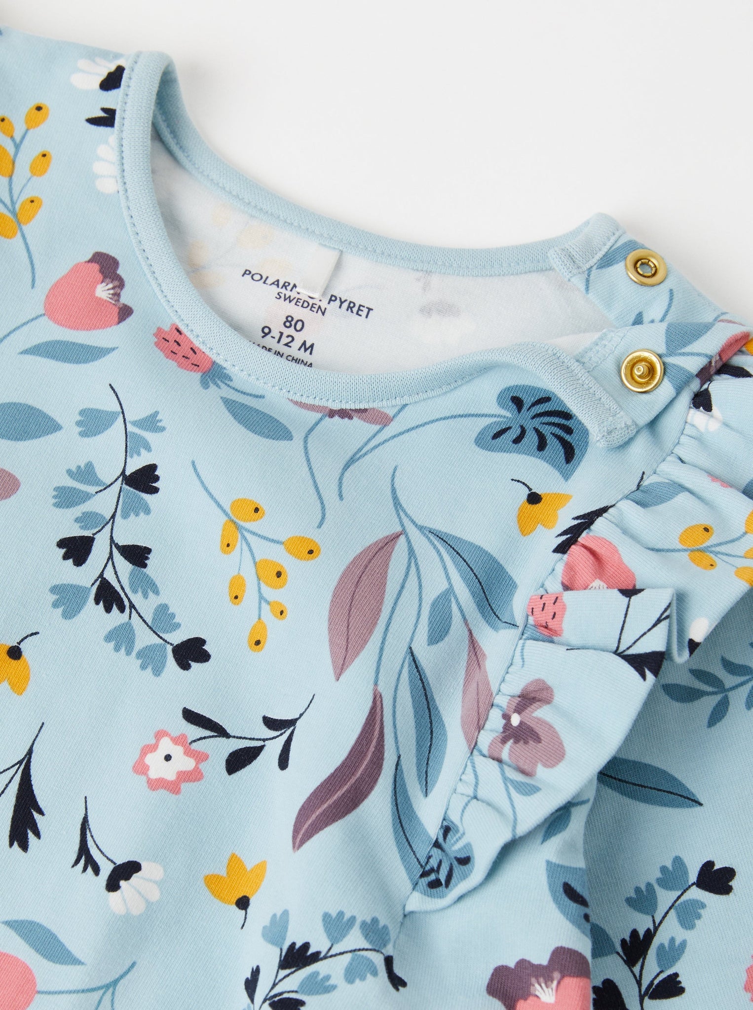 Blue Floral Wraparound Babygrow from the Polarn O. Pyret babywear collection. Nordic baby clothes made from sustainable sources.