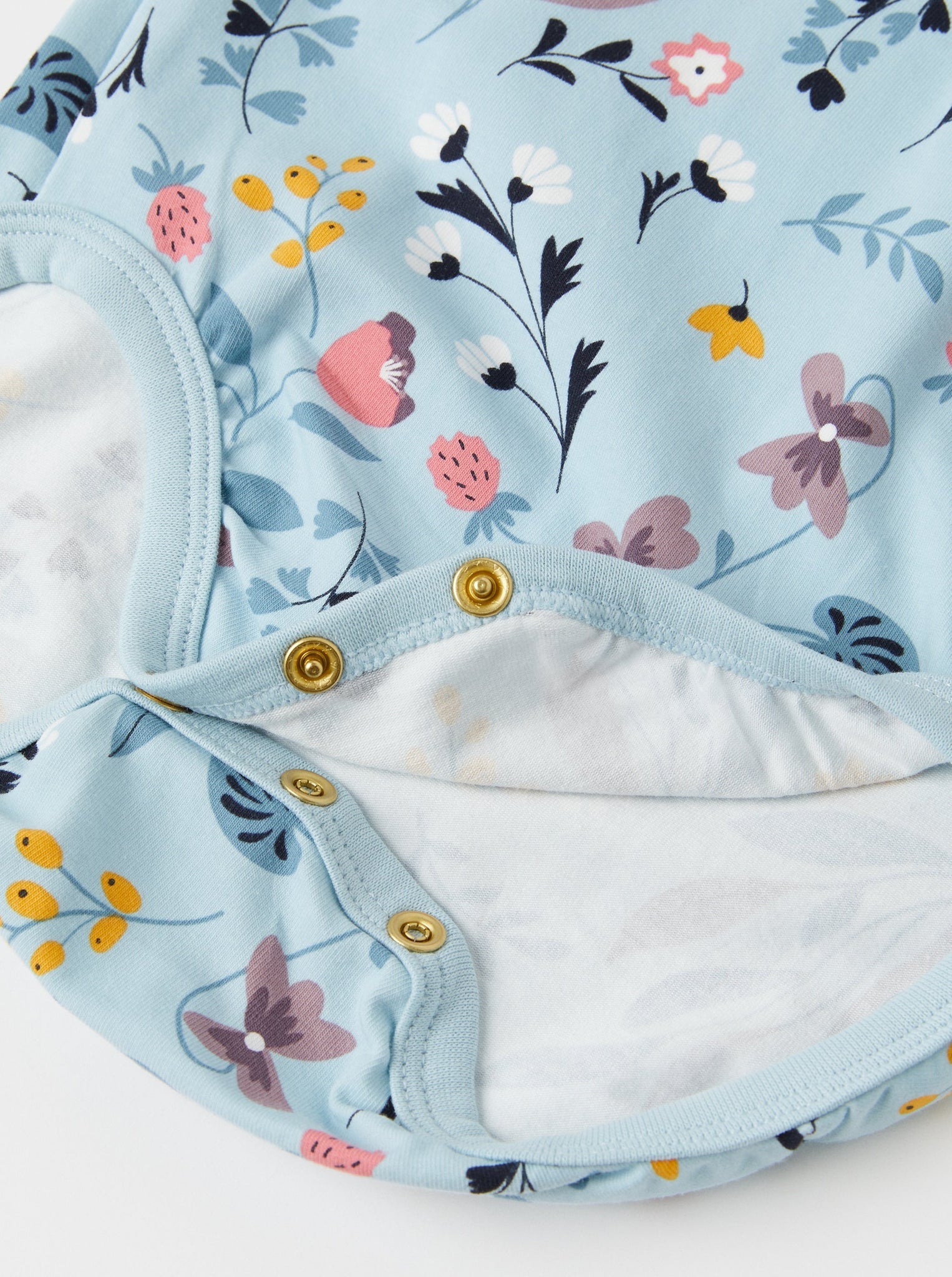 Blue Floral Wraparound Babygrow from the Polarn O. Pyret babywear collection. Nordic baby clothes made from sustainable sources.