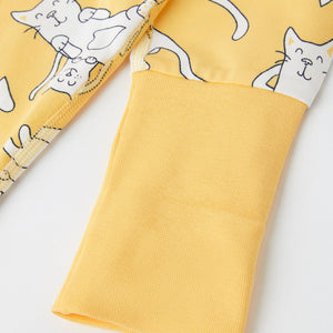 Cat Print Yellow Kids Sleepsuit from the Polarn O. Pyret babywear collection. Ethically produced kids clothing.