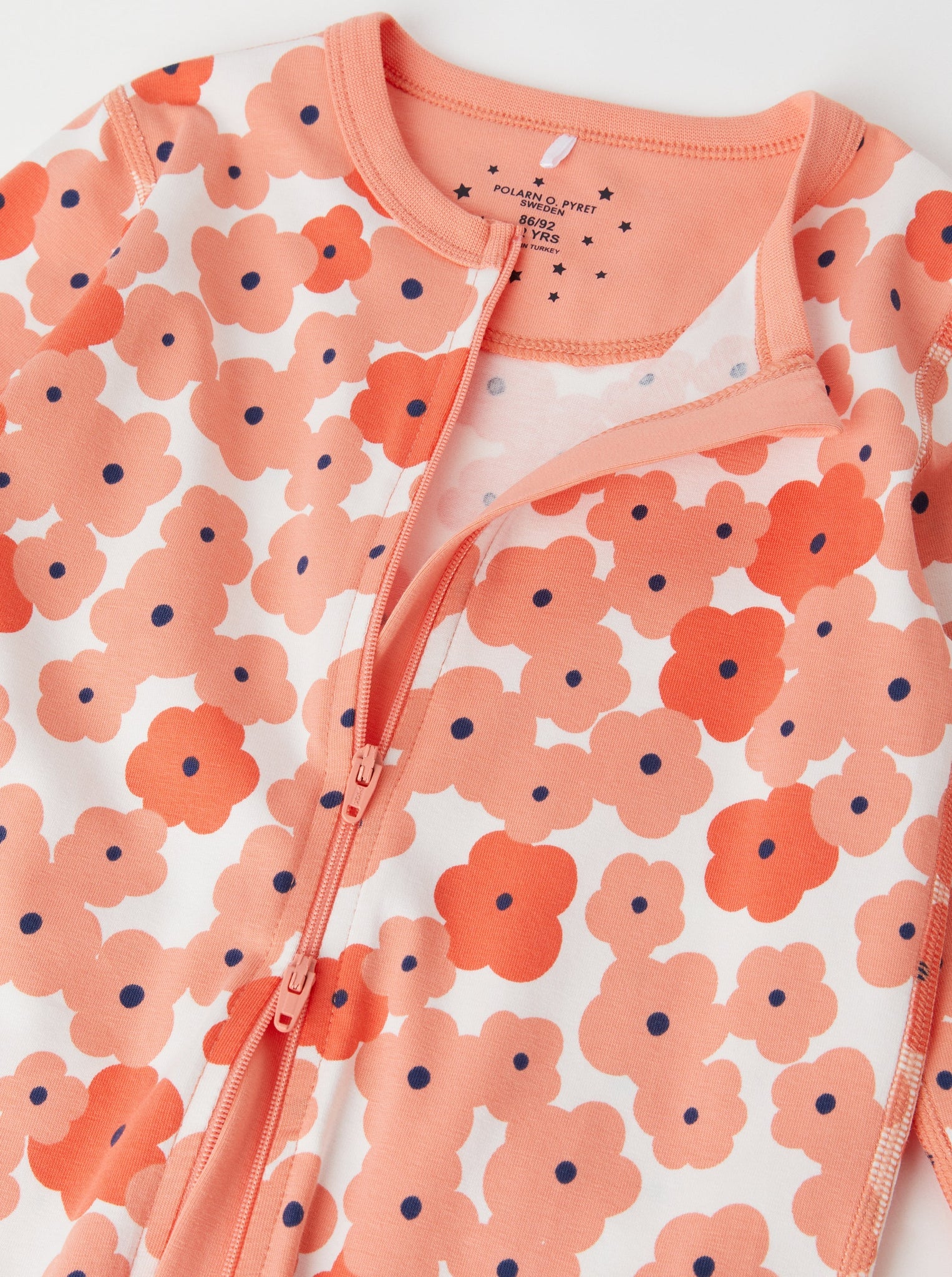 Floral Print Orange Kids Sleepsuit from the Polarn O. Pyret kidswear collection. The best ethical kids clothes