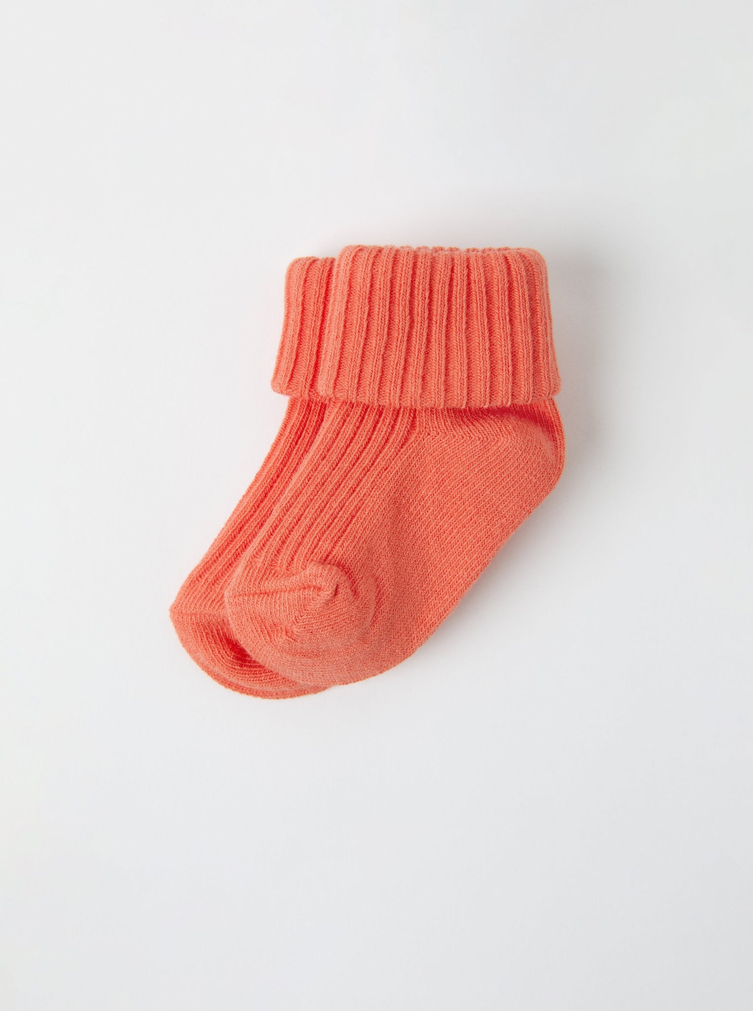 Organic Cotton Orange Baby Socks from the Polarn O. Pyret babywear collection. Clothes made using sustainably sourced materials.
