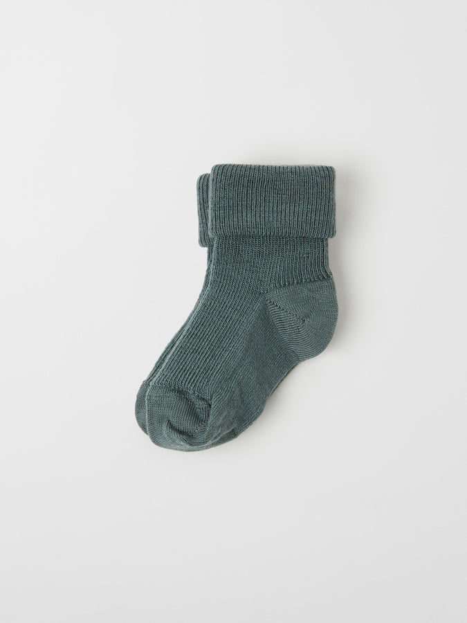 Green Merino Wool Baby Socks from the Polarn O. Pyret baby collection. Clothes made using sustainably sourced materials.