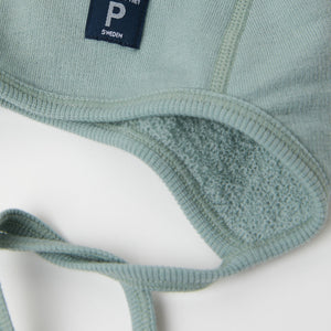 Merino Wool Green Baby Helmet Hat from the Polarn O. Pyret outerwear collection. Quality kids clothing made to last.