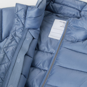 Water Resistant Blue Kids Puffer Jacker from the Polarn O. Pyret outerwear collection. Made using ethically sourced materials.