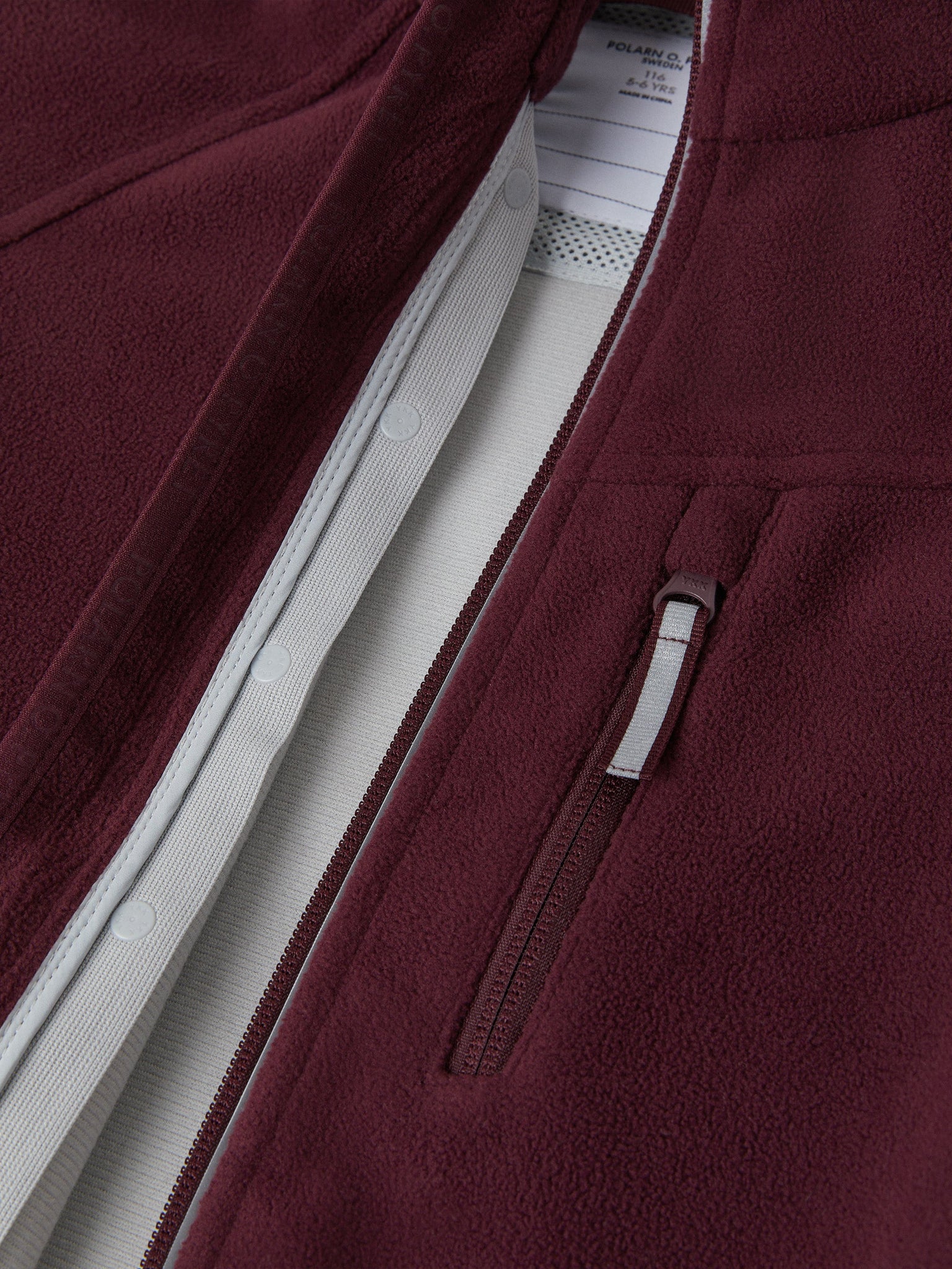 Burgundy Waterproof Kids Fleece Jacket from the Polarn O. Pyret outerwear collection. Ethically produced kids outerwear.
